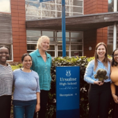 4 members of the NIHR King's Clinical Research Facility and a PPI member stood outside Ursuline High School