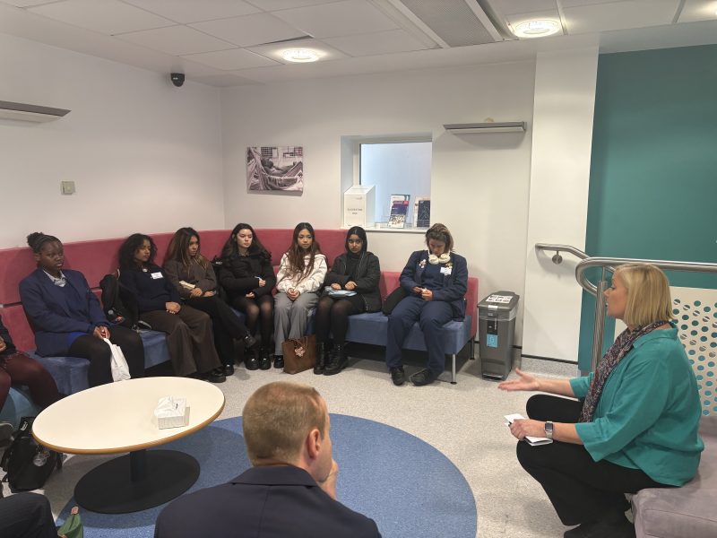 Students from the Ursuline High School sat in the Patient Lounge of the CRF listening to a talk