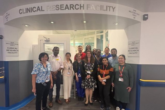 Dr Austin Kulasekararaj and members of the Clinical Research Facility (CRF) team standing outside of the main entrance of the CRF team)